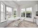 Sunlit breakfast nook with a built in bench and large windows at 622 Bayou Cir, Clover, SC 29710