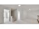 Bright upstairs hallway with neutral carpet and white walls leading to open doorways at 622 Bayou Cir, Clover, SC 29710
