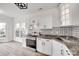 Charming kitchen has stainless steel appliances, patterned backsplash, granite countertops, and bright natural light at 622 Bayou Cir, Clover, SC 29710