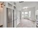 This well-lit kitchen includes stainless steel appliances, shelving, white cabinets, and an eat-in breakfast area at 622 Bayou Cir, Clover, SC 29710