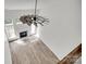 Bright open-concept living room with wood floors, fireplace, and modern farmhouse ceiling fan at 622 Bayou Cir, Clover, SC 29710