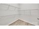 Walk-in closet with wooden-look floors and several wire shelves for plenty of storage at 622 Bayou Cir, Clover, SC 29710