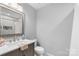 Stylish bathroom with a modern vanity, and neutral wall color at 6406 Old Meadow Rd, Charlotte, NC 28227