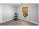 Bedroom with hardwood floors, closet, and natural light at 6406 Old Meadow Rd, Charlotte, NC 28227