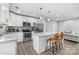 Well-lit kitchen featuring granite countertops, stainless steel appliances, and a center island with seating at 6406 Old Meadow Rd, Charlotte, NC 28227