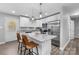 Modern kitchen featuring a large island with granite countertops and stainless steel appliances at 6406 Old Meadow Rd, Charlotte, NC 28227