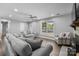Inviting living room with plenty of natural light, ceiling fan, and comfortable seating at 6406 Old Meadow Rd, Charlotte, NC 28227