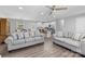 Open concept living room showcasing modern furnishings and seamless flow to kitchen at 6406 Old Meadow Rd, Charlotte, NC 28227