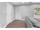 Bright living room featuring neutral tones, new flooring, and a modern front door at 6406 Old Meadow Rd, Charlotte, NC 28227
