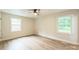 Bright bedroom with new floors, neutral paint, ceiling fan, and double-hung windows at 6641 Pawnee Dr, Charlotte, NC 28214