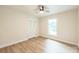 This bedroom features wood flooring, neutral paint, and a closet with louvered doors at 6641 Pawnee Dr, Charlotte, NC 28214