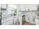 Bright modern kitchen features a farmhouse sink and plenty of cabinets at 6641 Pawnee Dr, Charlotte, NC 28214