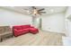 Open-concept living room with ceiling fan and neutral paint at 6641 Pawnee Dr, Charlotte, NC 28214