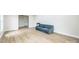 Spacious living room with light wood floors, neutral paint, and ample natural light at 6641 Pawnee Dr, Charlotte, NC 28214