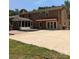 Spacious backyard features brick house, enclosed patio and parking area at 715 Gentry Pl, Charlotte, NC 28210