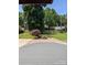 A well-maintained backyard with a cozy outdoor seating area with a custom-built fire pit at 715 Gentry Pl, Charlotte, NC 28210