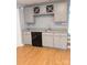 Basement bar area featuring gray cabinets, granite countertop, and wine storage at 715 Gentry Pl, Charlotte, NC 28210