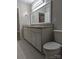 Bathroom featuring a double sink vanity with granite countertop and modern fixtures at 715 Gentry Pl, Charlotte, NC 28210