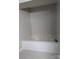 Bathroom showing soaking tub with tile surround and deck-mounted faucet and handle at 715 Gentry Pl, Charlotte, NC 28210