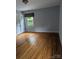 Comfortable bedroom featuring hardwood floors and a closet at 715 Gentry Pl, Charlotte, NC 28210