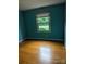 Bright bedroom with a window providing natural light and hardwood flooring at 715 Gentry Pl, Charlotte, NC 28210