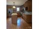 Modern kitchen boasts stainless steel appliances, granite counters, and ample cabinet space at 715 Gentry Pl, Charlotte, NC 28210