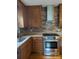 Updated kitchen with stainless steel oven, granite counters, and stylish backsplash at 715 Gentry Pl, Charlotte, NC 28210