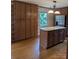 Eat-in kitchen featuring an island, stainless refrigerator and custom cabinetry at 715 Gentry Pl, Charlotte, NC 28210