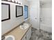 Bathroom with double vanity, tiled floor, and combined shower and tub at 7308 Pleasant Hill Church Rd, Marshville, NC 28103