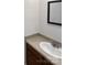 Clean bathroom showcasing a white sink, neutral countertop, and modern mirror at 7308 Pleasant Hill Church Rd, Marshville, NC 28103