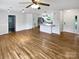 Open-concept living area with hardwood floors connecting to kitchen and other rooms at 7308 Pleasant Hill Church Rd, Marshville, NC 28103