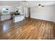 Bright and airy living space with hardwood floors connecting the living area to the modern kitchen at 7308 Pleasant Hill Church Rd, Marshville, NC 28103