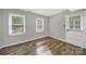 Neutral bedroom with natural light with a view of backyard through the windows at 8514 Timber Crest Cir, Charlotte, NC 28226