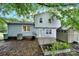 Exterior showing the back of a light blue house with a shed and landscaping at 8514 Timber Crest Cir, Charlotte, NC 28226