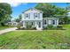 Charming home with blue siding, shutters, and a well-manicured front lawn at 8514 Timber Crest Cir, Charlotte, NC 28226