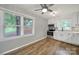 Bright kitchen with white cabinets, stainless steel appliances, and hardwood floors at 8514 Timber Crest Cir, Charlotte, NC 28226