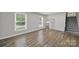 Spacious living room with hardwood floors, recessed lights, and neutral wall color at 8514 Timber Crest Cir, Charlotte, NC 28226