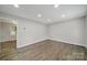 Spacious living room with hardwood floors, recessed lights, and neutral wall color at 8514 Timber Crest Cir, Charlotte, NC 28226