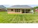 This home features a brick exterior, large backyard, and a covered patio great for entertaining guests at 8840 Mullis Forest Ct, Mint Hill, NC 28227