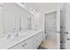 Bright bathroom featuring double sinks, a large mirror, and a separate shower and tub at 8840 Mullis Forest Ct, Mint Hill, NC 28227