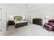Spacious bedroom with a tray ceiling, carpet flooring, and ample space for furnishings at 8840 Mullis Forest Ct, Mint Hill, NC 28227