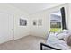 Cozy bedroom with a daybed, a window providing natural light, and sports decor at 8840 Mullis Forest Ct, Mint Hill, NC 28227