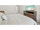 Bedroom featuring a comfortable bed, wooden dresser, and TV for relaxing evenings at 8840 Mullis Forest Ct, Mint Hill, NC 28227