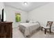 Relaxing bedroom with natural light, neutral walls and a view to the yard at 8840 Mullis Forest Ct, Mint Hill, NC 28227