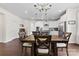 Dining room with table, chairs, and view into open kitchen at 8840 Mullis Forest Ct, Mint Hill, NC 28227