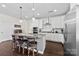 Kitchen with stainless steel appliances, granite countertops, and breakfast bar seating at 8840 Mullis Forest Ct, Mint Hill, NC 28227