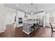 Open kitchen with stainless steel appliances, granite countertops, and breakfast bar seating at 8840 Mullis Forest Ct, Mint Hill, NC 28227