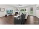 Cozy living room with fireplace, ceiling fan, and backyard view at 8840 Mullis Forest Ct, Mint Hill, NC 28227