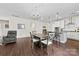 Open floor plan with kitchen, dining area, and sitting area at 8840 Mullis Forest Ct, Mint Hill, NC 28227