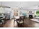 Open floor plan with kitchen, dining area, and living room with fireplace at 8840 Mullis Forest Ct, Mint Hill, NC 28227